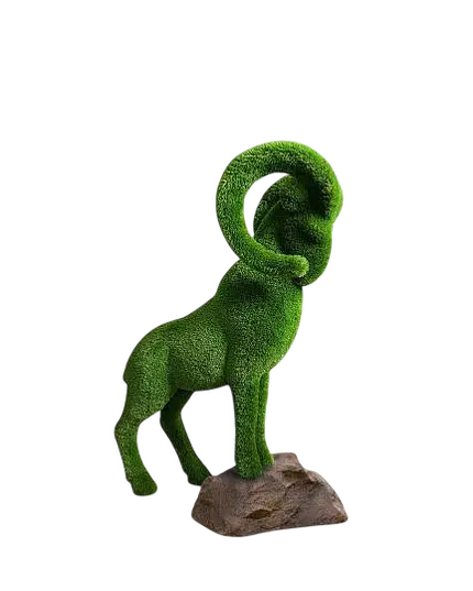 Summit, a life-size mountain goat topiary sculpture in premium artificial grass, posed mid-climb for outdoor landscape design from the Journey Collection.