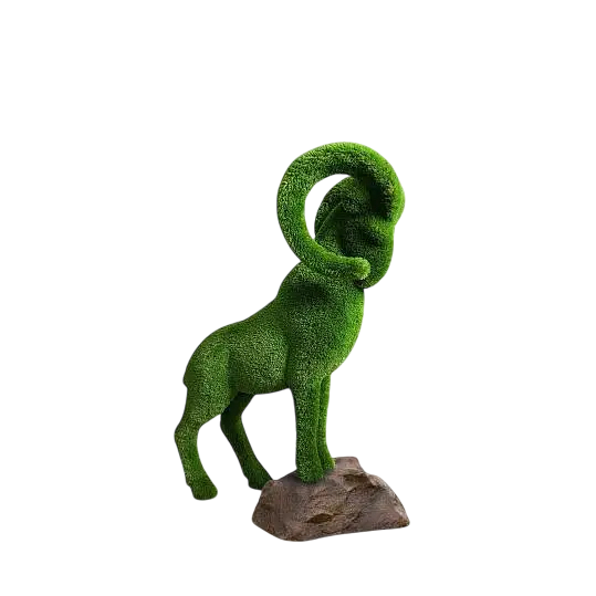 Summit, a life-size mountain goat topiary sculpture in premium artificial grass, posed mid-climb for outdoor landscape design from the Journey Collection.