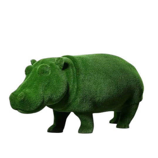 Oasis, a life-size hippo topiary sculpture in artificial grass, posed in a grounded stance as part of the Aquatic Collection.