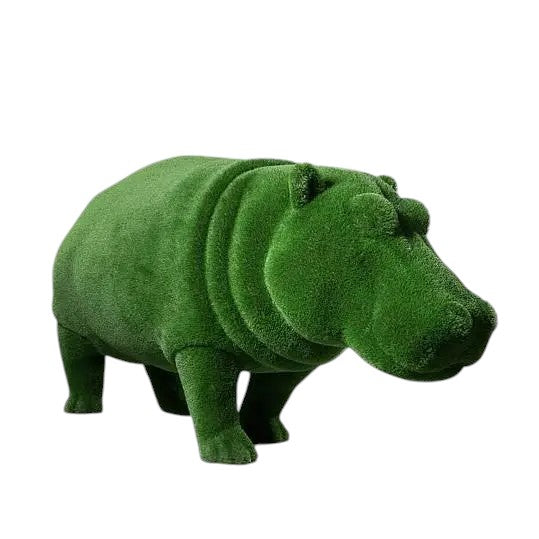 Oasis, a life-size hippo topiary sculpture in artificial grass, posed in a grounded stance as part of the Aquatic Collection.