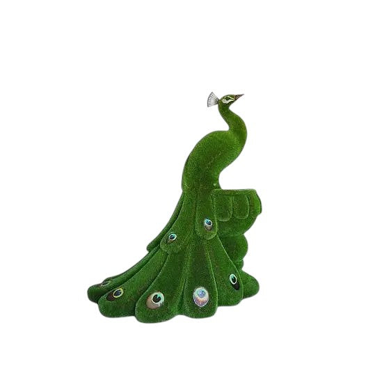 Majesty, a life-size peacock topiary sculpture perched on a vase, handcrafted in artificial grass as part of the Majestic Collection.