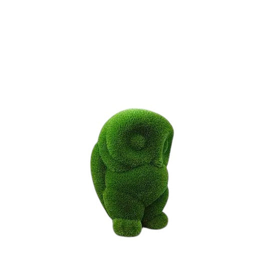 Lumen, a baby owl topiary sculpture in artificial grass, crafted as a delicate companion piece in the Celestial Collection.