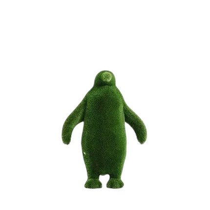Emperor, a life-size penguin topiary sculpture in artificial grass, walking in a poised stance from the Guardians Collection.