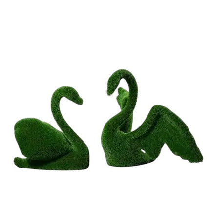 Sonnet & Aria, a life-size swan topiary sculpture pair in artificial grass, designed in complementary poses to reflect grace and harmony from the Grace Collection.