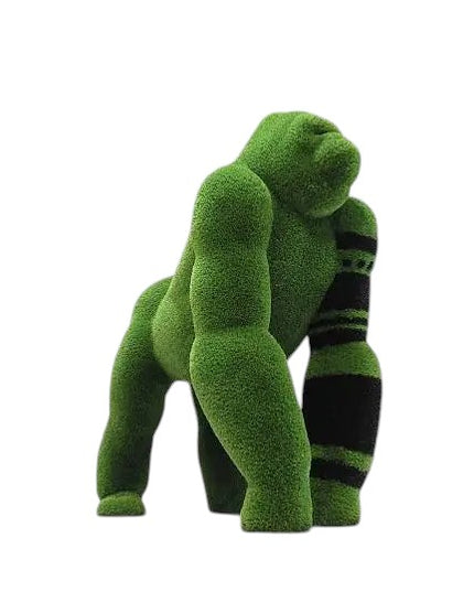 Oba, a life-size gorilla topiary sculpture in artificial grass, posed on all fours with tribal markings and a raised head from the Majestic Collection.