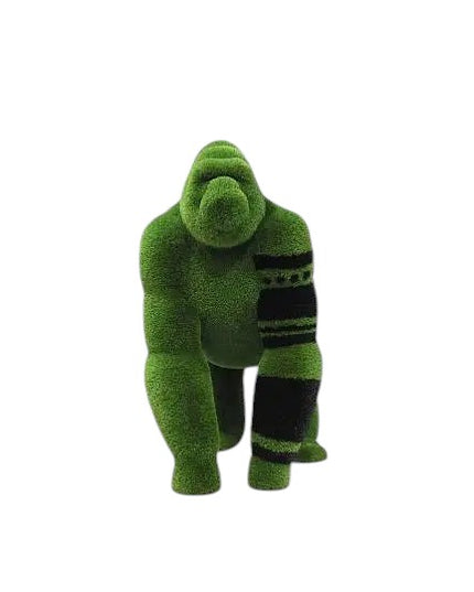 Oba, a life-size gorilla topiary sculpture in artificial grass, posed on all fours with tribal markings and a raised head from the Majestic Collection.