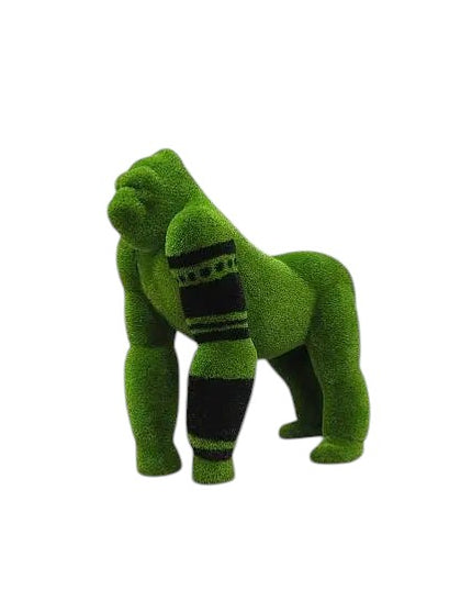 Oba, a life-size gorilla topiary sculpture in artificial grass, posed on all fours with tribal markings and a raised head from the Majestic Collection.