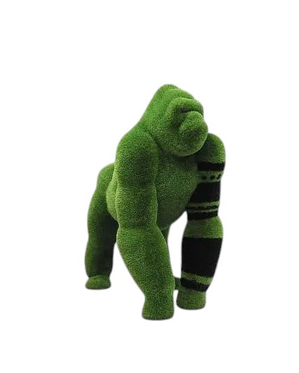 Oba, a life-size gorilla topiary sculpture in artificial grass, posed on all fours with tribal markings and a raised head from the Majestic Collection.