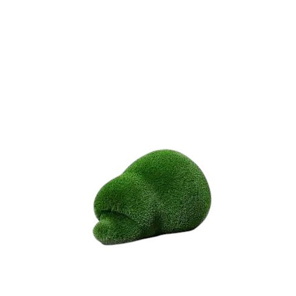 Thistle, a life-size hedgehog topiary sculpture in artificial grass, posed in a rounded, grounded form from the Grace Collection.