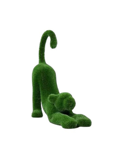 Aurelia, a baby lioness topiary sculpture in artificial grass, posed in a catlike stretch with tail lifted from the Majestic Collection.