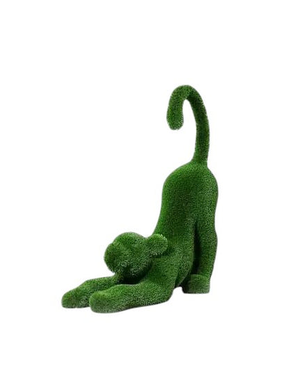 Aurelia, a baby lioness topiary sculpture in artificial grass, posed in a catlike stretch with tail lifted from the Majestic Collection.