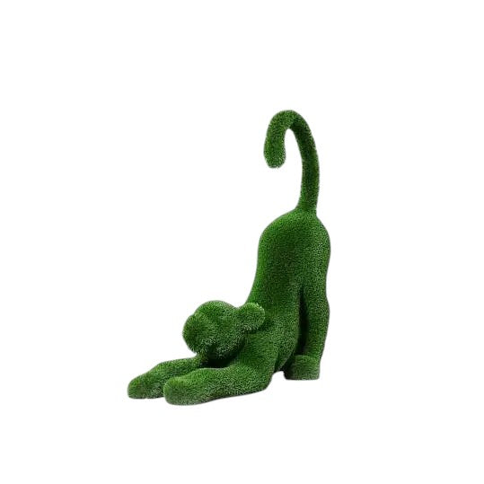 Aurelia, a baby lioness topiary sculpture in artificial grass, posed in a catlike stretch with tail lifted from the Majestic Collection.