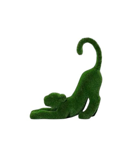 Aurelia, a baby lioness topiary sculpture in artificial grass, posed in a catlike stretch with tail lifted from the Majestic Collection.