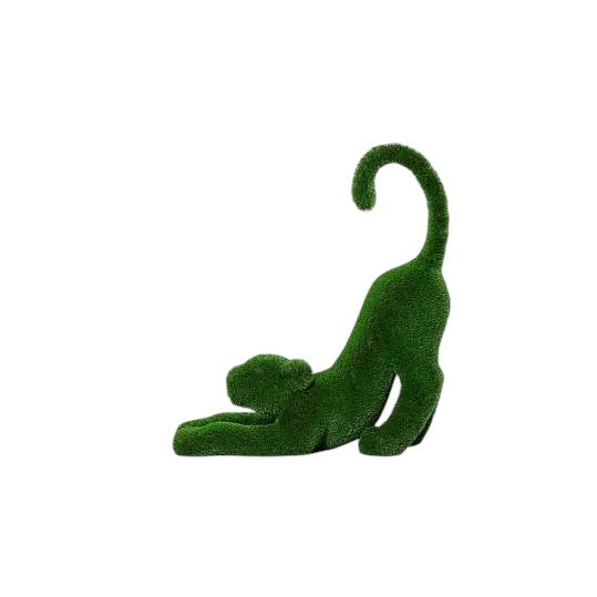 Aurelia, a baby lioness topiary sculpture in artificial grass, posed in a catlike stretch with tail lifted from the Majestic Collection.