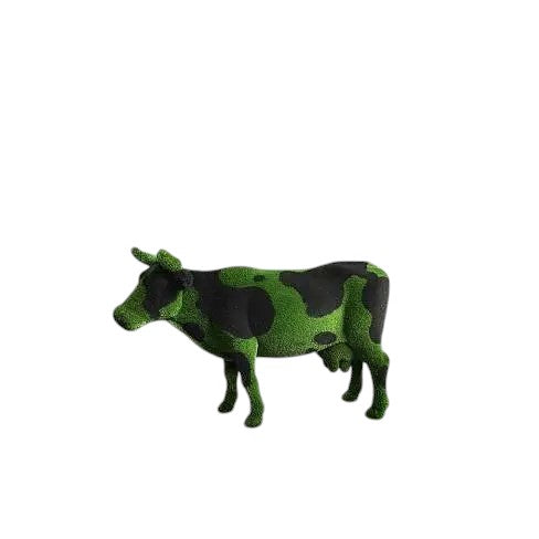 Luxury cow sculpture named Noirelle in black and green artificial grass, designed for bold outdoor landscape installations.
