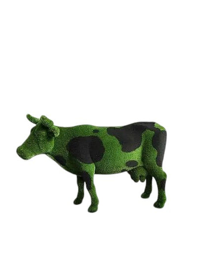 Luxury cow sculpture named Noirelle in black and green artificial grass, designed for bold outdoor landscape installations.