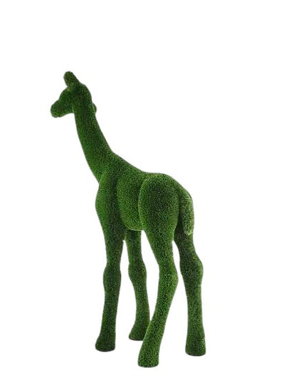 Small giraffe topiary sculpture in artificial grass.