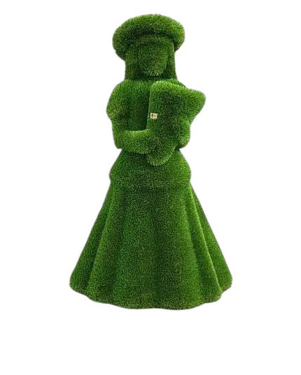 Topiary sculpture of flower girl wearing a summer hat and holding a bouquet, made of artificial grass


