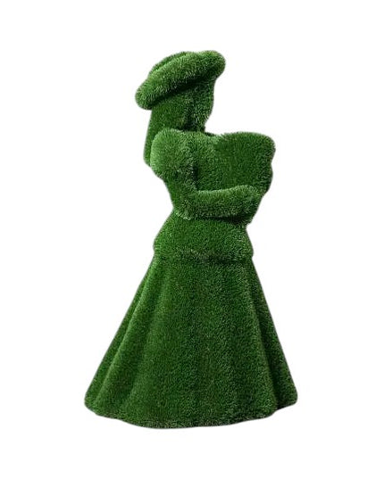 Topiary sculpture of flower girl wearing a summer hat and holding a bouquet, made of artificial grass

