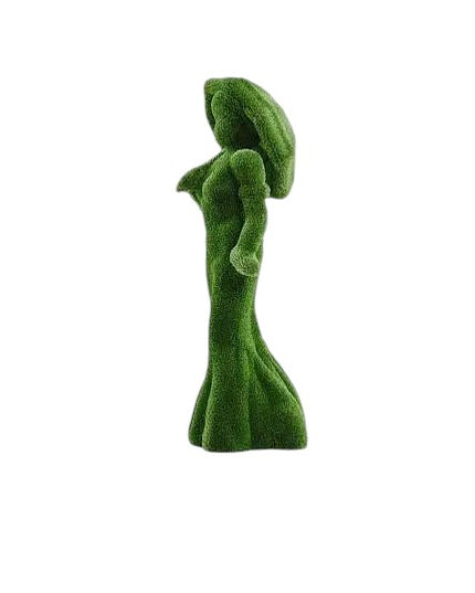 Topiary sculpture of lady in floor-length dress holding umbrella over shoulder, made of artificial grass

