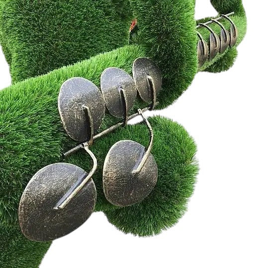 Saxophone player topiary sculpture with braces and sunglasses, hunched mid-performance


