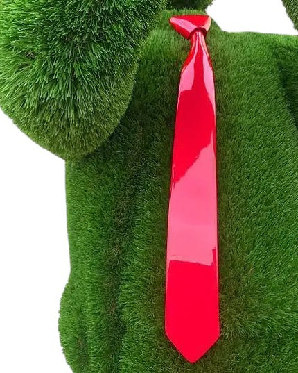 Trumpet player topiary sculpture in blazer and hat, playing upward into the sky

