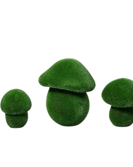 Porcini mushroom sculptures in small, medium, and large sizes wrapped in artificial grass, botanical topiary design


