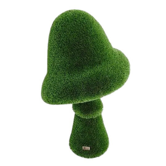 Sculptural amanita mushroom in artificial grass with wide cap and upright stem, botanical topiary design


