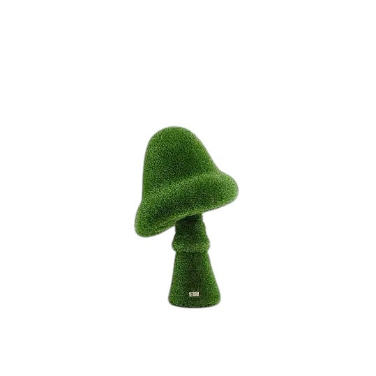 Sculptural amanita mushroom in artificial grass with wide cap and upright stem, botanical topiary design

