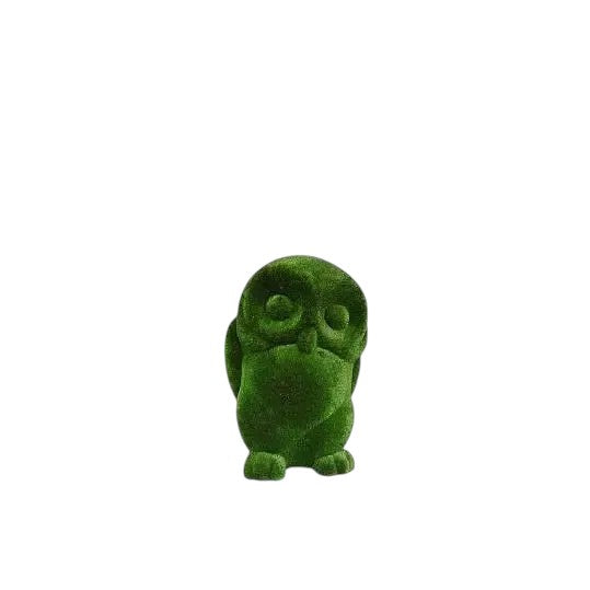 Sage, a life-size owl topiary sculpture in artificial grass, perched in stillness as part of the Guardians Collection.