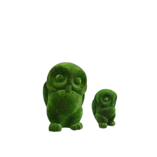 Sage, a life-size owl topiary sculpture in artificial grass, perched in stillness as part of the Guardians Collection.