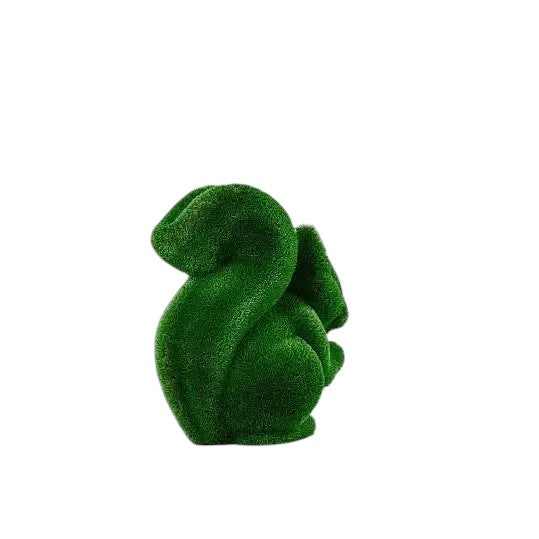 Wisp, a life-size squirrel topiary sculpture in artificial grass, posed in a moment of still curiosity from the Grace Collection.
