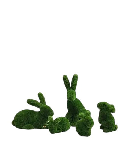 A family of rabbits -  topiary sculptures in artificial grass, from the Grace Collection.