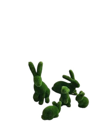 A family set of rabbit topiary sculptures in artificial grass, seated with quiet poise from the Grace Collection.