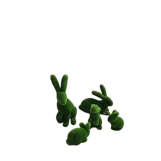 A family set of rabbit topiary sculptures in artificial grass, seated with quiet poise from the Grace Collection.