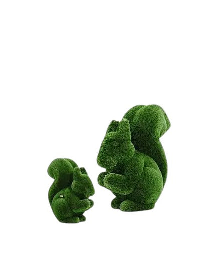 Life-size squirrel topiary sculpture set in artificial grass, posed in a moment of still curiosity from the Grace Collection.