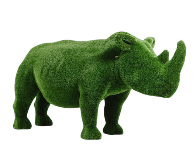 Titan, a life-size rhino topiary sculpture in artificial grass, showcasing bold form and sculptural presence from the Majestic Collection.