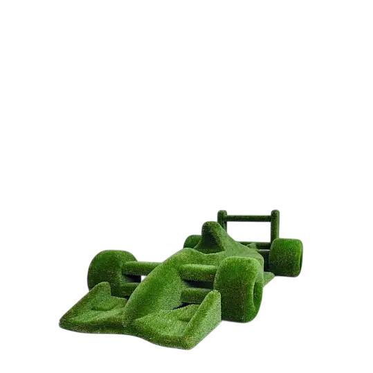Life-size F1 car sculpture wrapped in artificial grass, designed as a botanical performance piece


