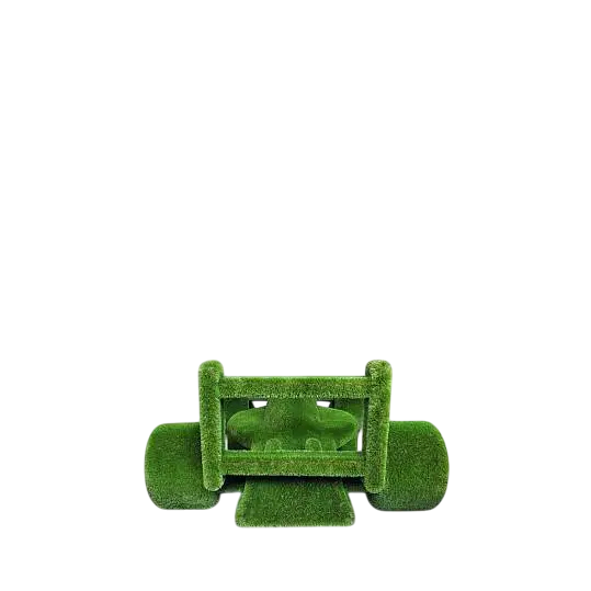 Life-size F1 car sculpture wrapped in artificial grass, designed as a botanical performance piece

