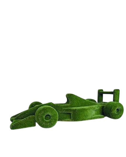 Life-size F1 car sculpture wrapped in artificial grass, designed as a botanical performance piece

