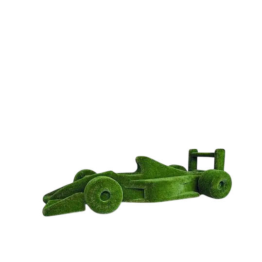 Life-size F1 car sculpture wrapped in artificial grass, designed as a botanical performance piece

