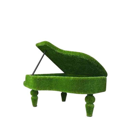 Sculptural grand piano wrapped in artificial grass, designed as a luxury statement piece

