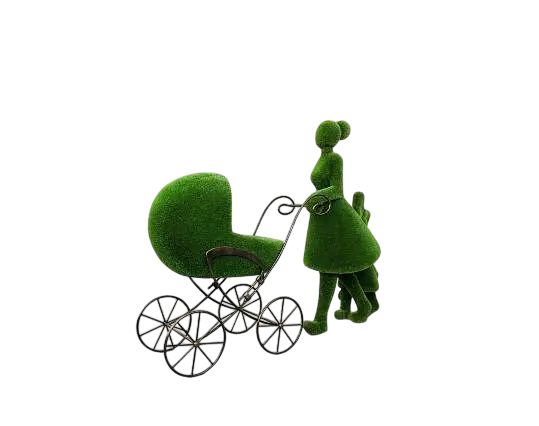 Topiary sculpture of mother pushing pram while holding daughter with teddy bear and bow

