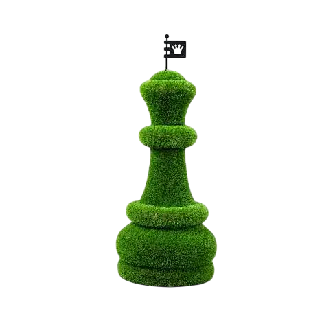 Oversized topiary chess sculptures made of artificial grass, including individual queen piece.

