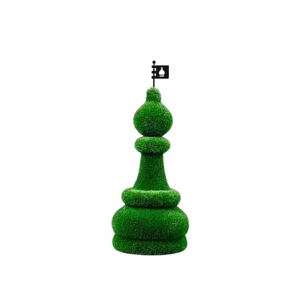 Oversized topiary chess sculptures made of artificial grass, including individual bishop piece.

