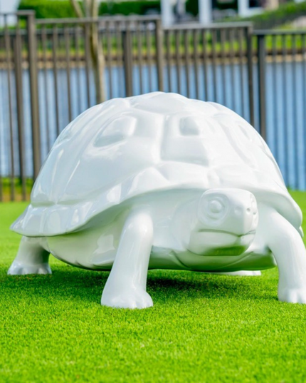 Minimalist turtle sculpture in primed white fiberglass