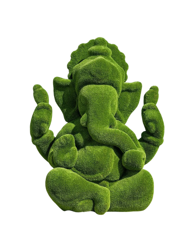 Sculpture of Ganesh as elephant deity in seated pose, wrapped in artificial grass.
